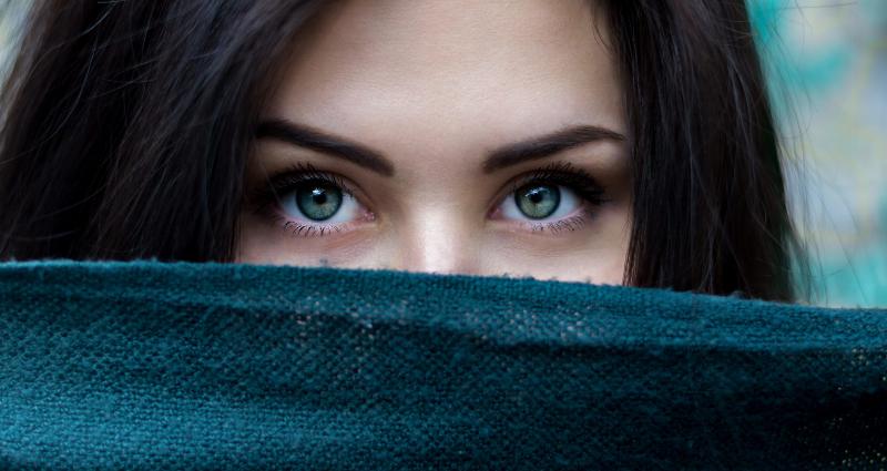 woman eyes look above scarf