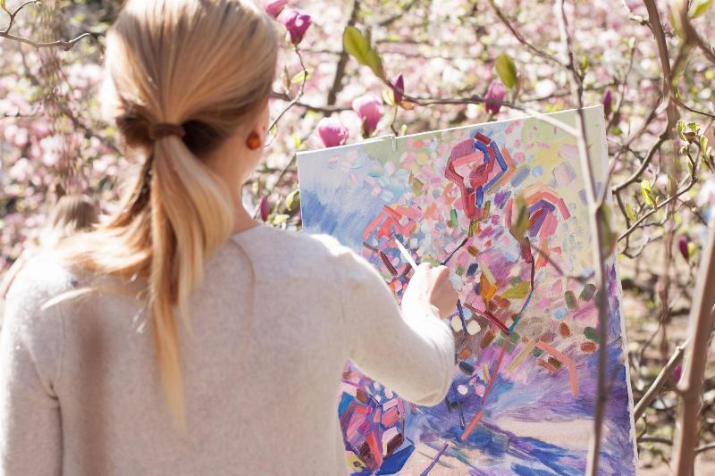 woman painting flowers