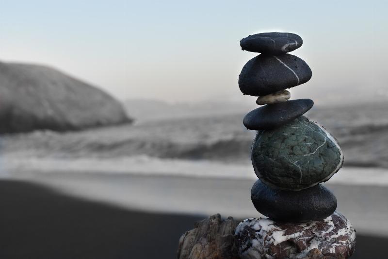 a couple of stones balancing by the shore