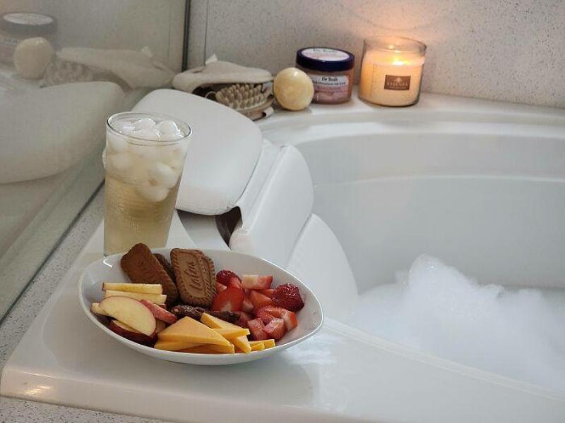 bath with a drink and snacks plate