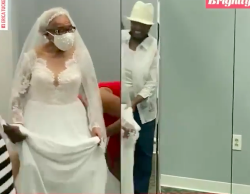 Martha smiling in wedding gown and wearing mask