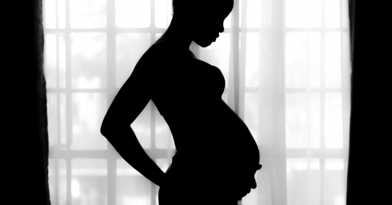 silhouette of a young pregnant woman
