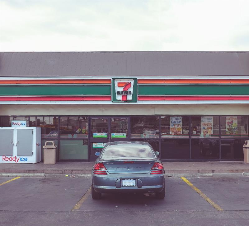 7/11 with car parked in front of it