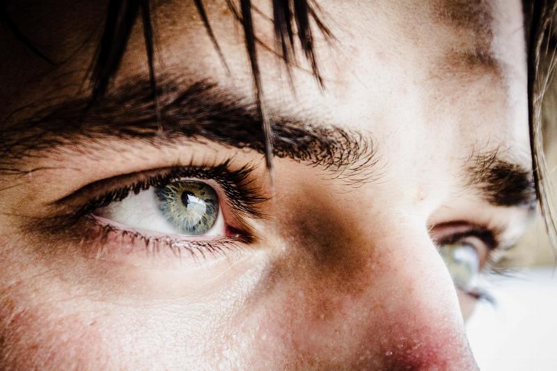 close up of man's green eyes