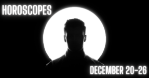 man stands in front of light circle