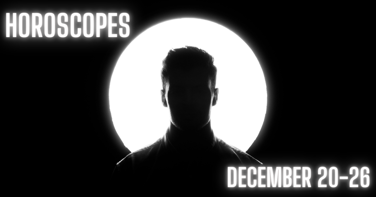 man stands in front of light circle