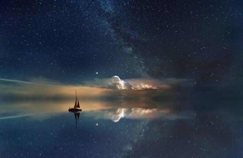 sailboat in the starry sky beside smokey portal