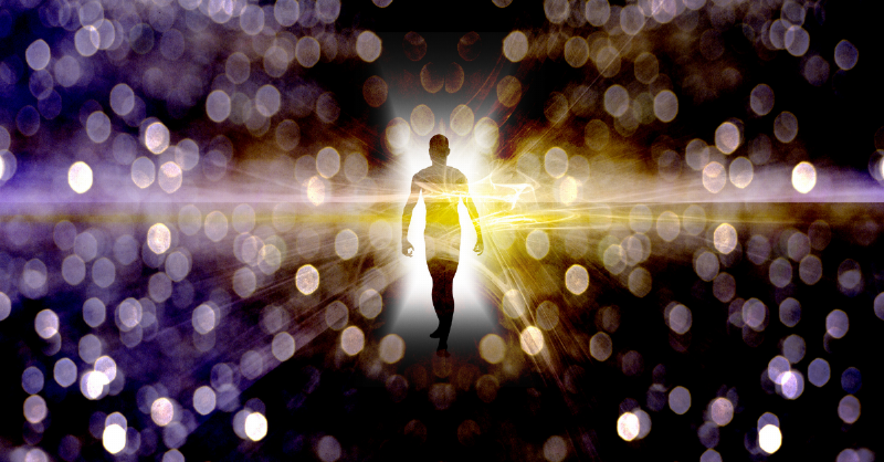 man standing in a series of light specles