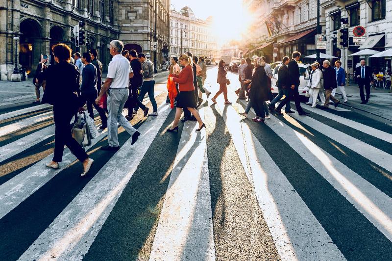 people crossing busy street in Europe