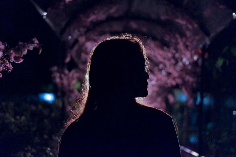 woman's profile in park at night