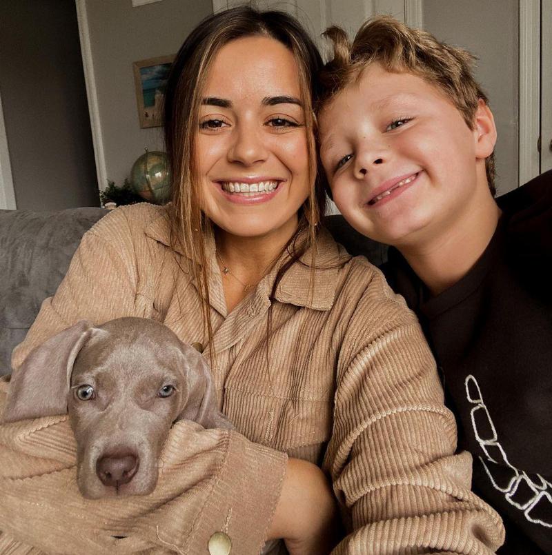paige and william taking selfie with puppy