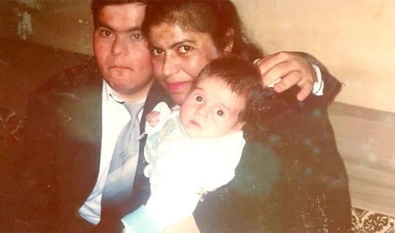 Sader with his parents as a baby