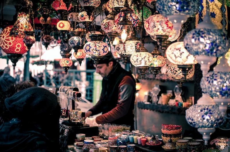 Turkish man working in his gift shop of handcrafted items