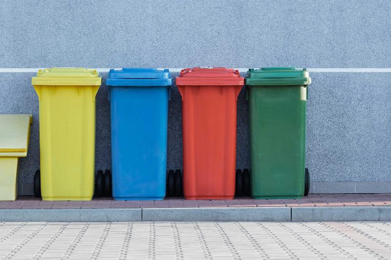 trash bins in four different colours