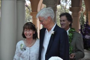 wedding photo with man looking at his bride and smiling