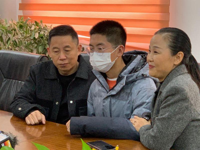 The long-lost son Sun Zhuo (C) with his father Sun Haiyang and his mother Peng Siying receives interview, after being reunited, on December 7, 2021 in Jingzhou, Hubei Province of China. After searching for 14 years, Sun Haiyang and his wife Peng Siying were reunited with their lost son Sun Zhuo on Monday in Shenzhen, Guangdong Province. Sun Zhuo was abducted at the age of 4 in 2007 in Shenzhen, and was found by police in 2021 in Shandong Province. Chinese 2014 movie 'Dearest', directed by Peter Chan Ho-sun, was based on the case of Sun Zhuo.