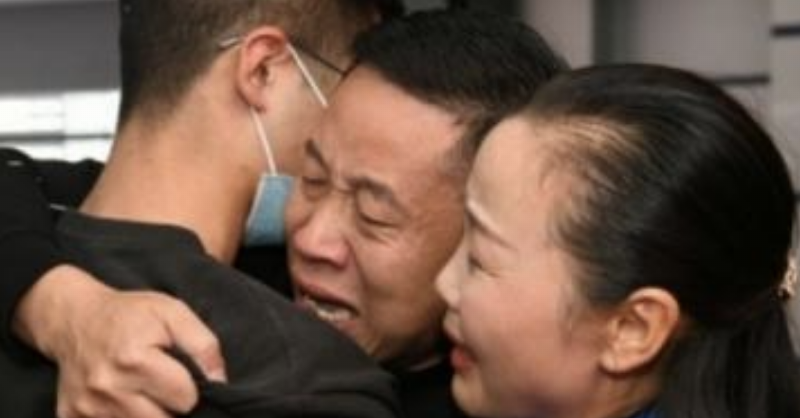 parents hug their kidnapped son, 18 years later