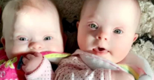 twins with green eyes looking at the camera