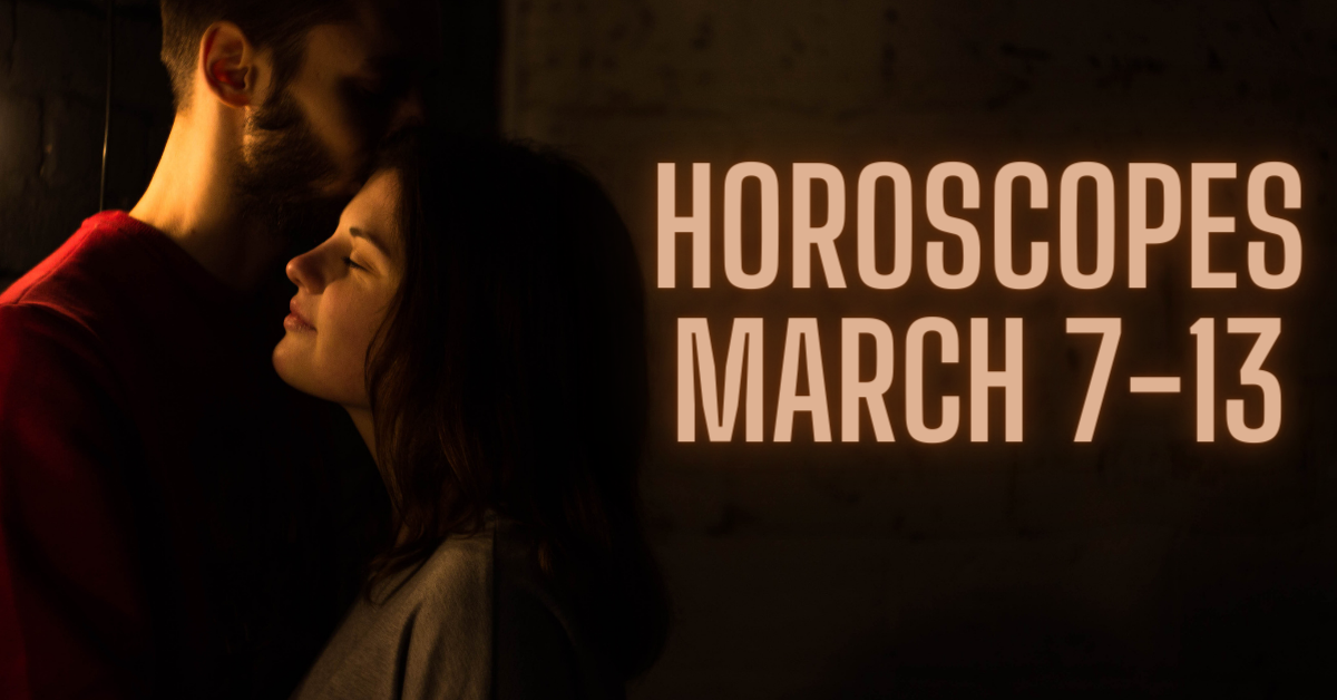 man kissing woma's forehead beside 