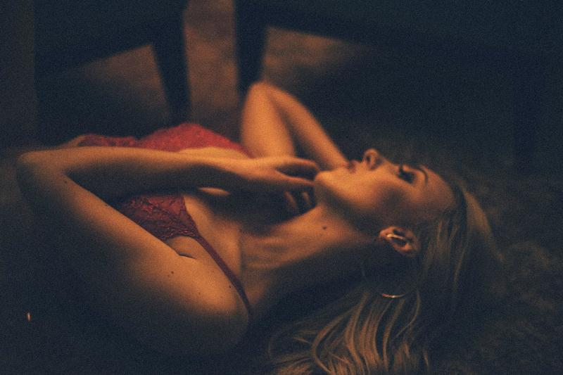 woman in red lingerie laying down on the floor