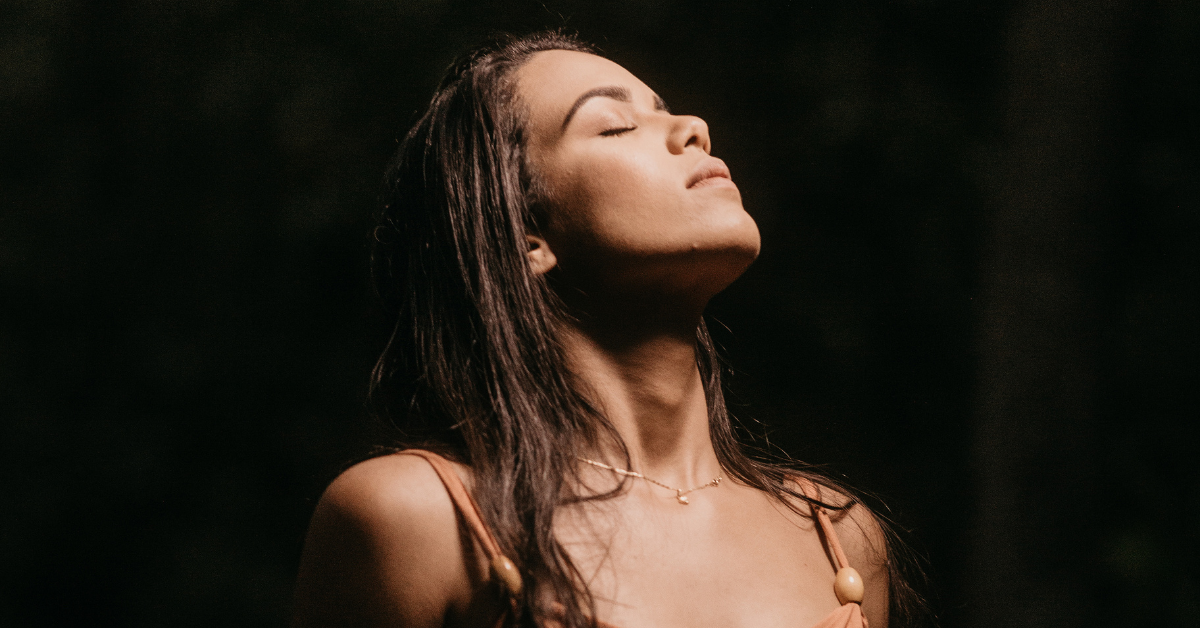 woman breathing with eyes closed