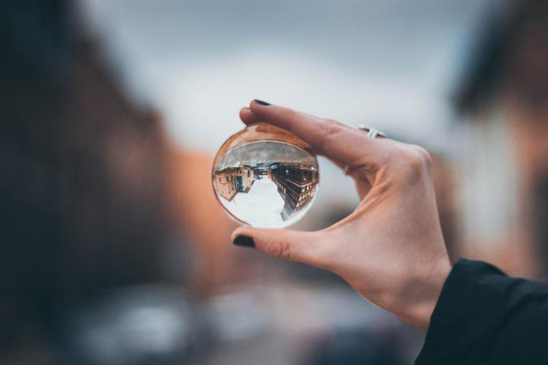 woman holding reflective bubble