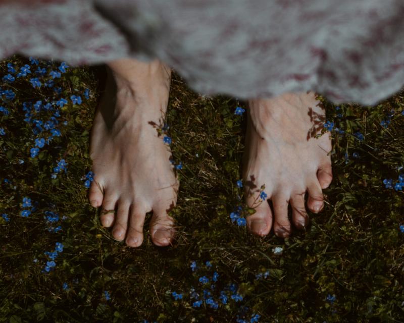 feet standing in grass