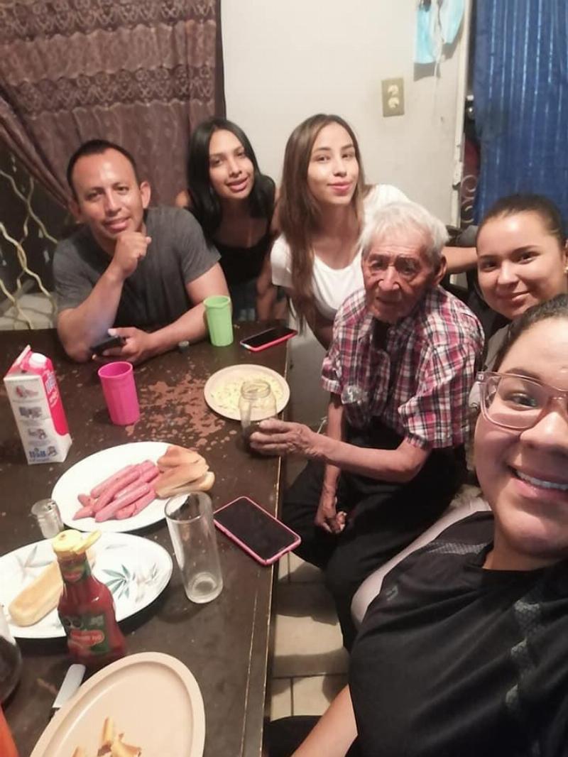 Benita's family with Don eating a meal