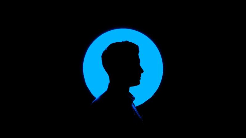 man with blue circle around his face silouhette