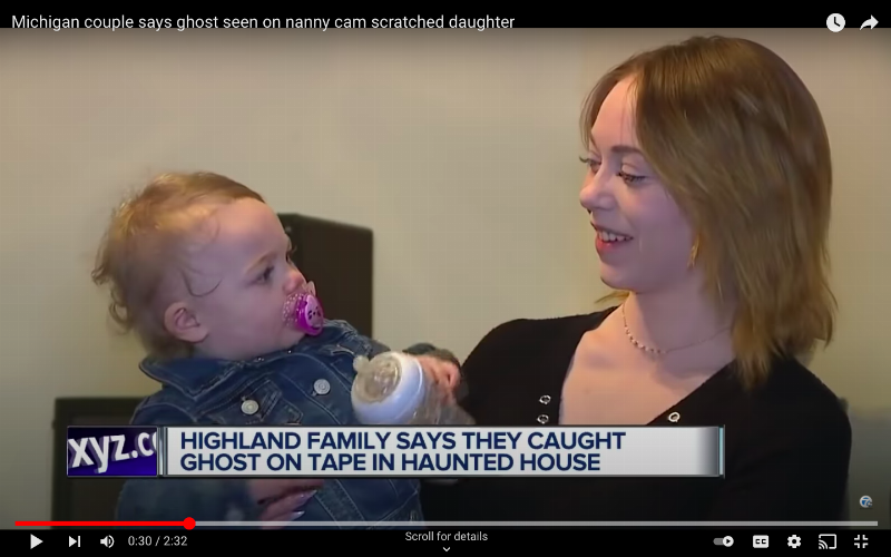 news interview shows mom holding her baby