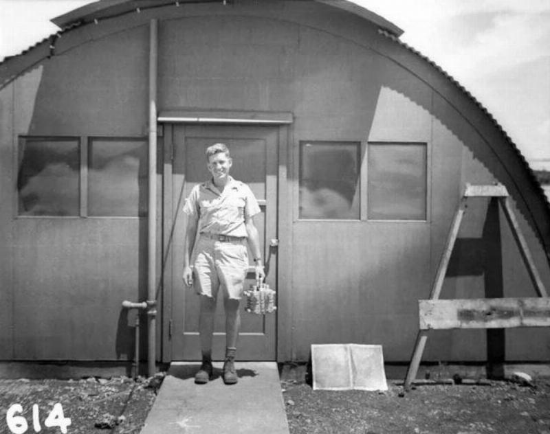 American physicist Harold Agnew holding the nuclear core of the Fat Man atomic bomb. (