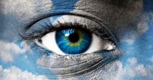 Blue eye with blue sky pattern - spiritual concept