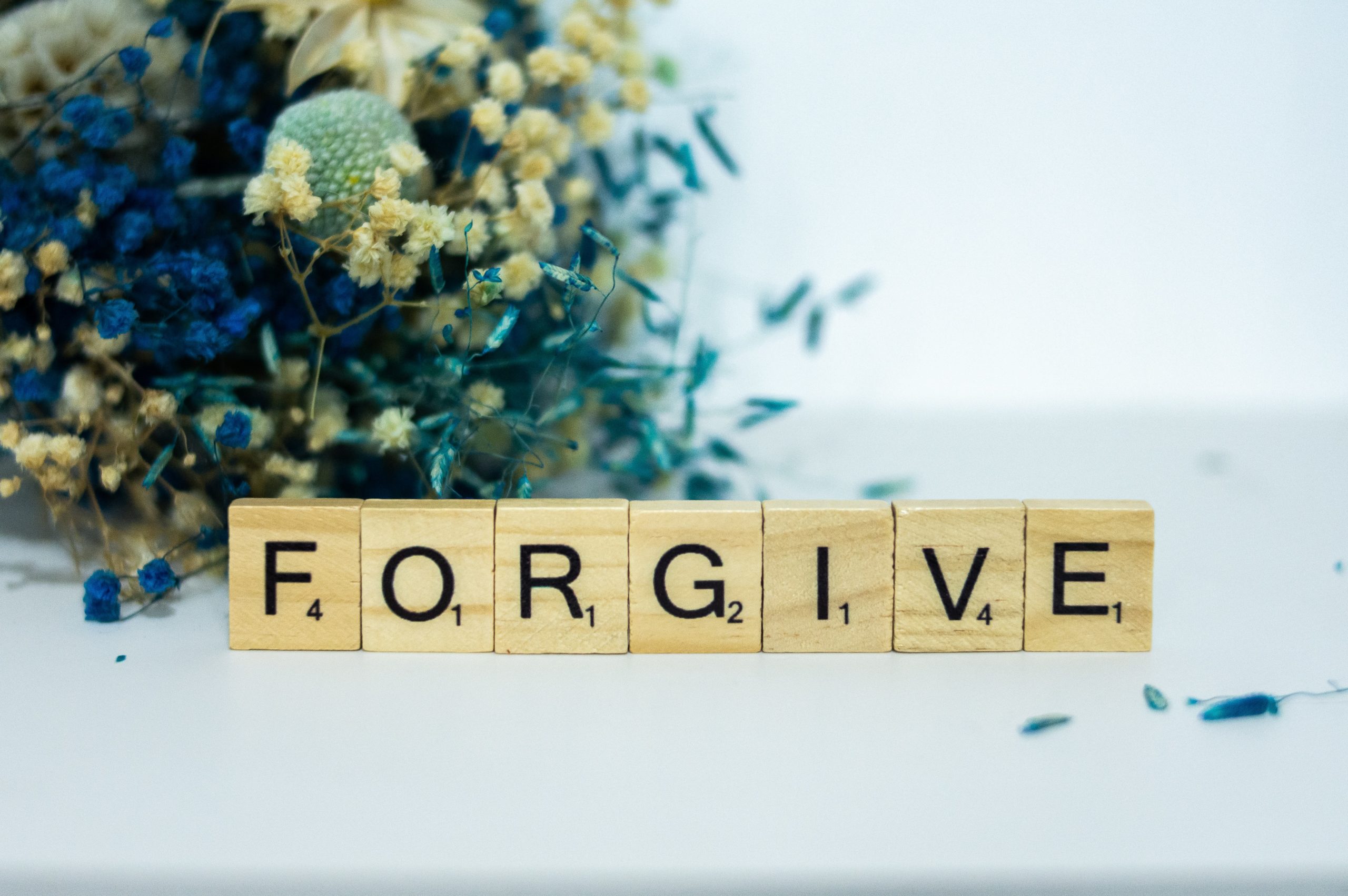 "Forgive" spelled out with scrabble letters