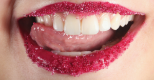 Tongue licking sugared red lips